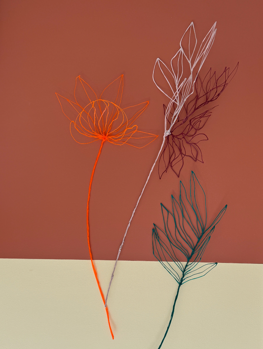 Orange flower + light pink/brown flower + green leaves