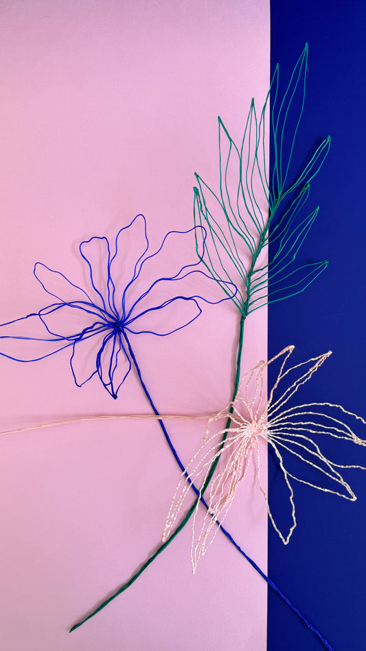 Blue flower + green leaves + light pink flower