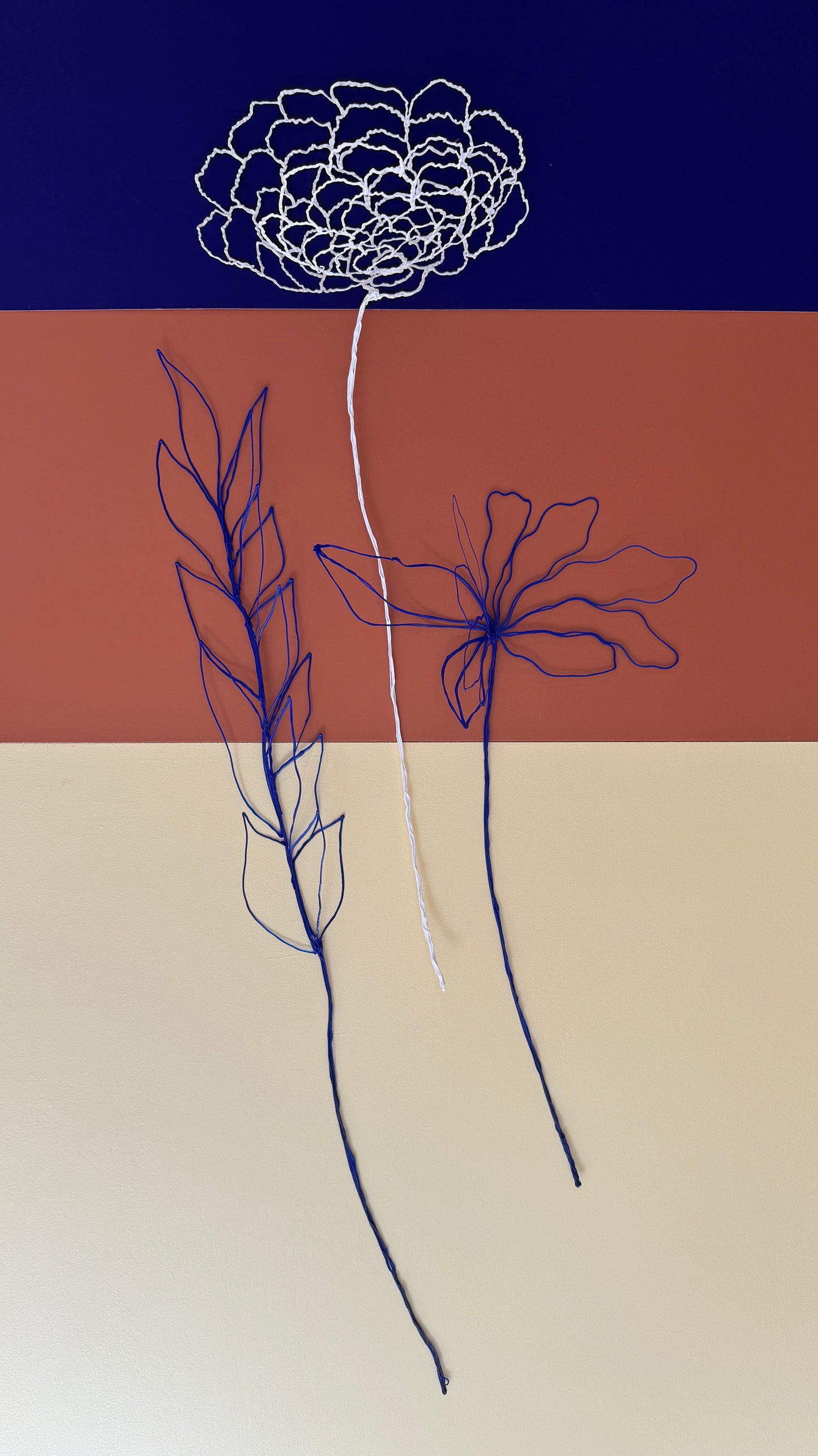 Blue leaves + white flower + blue flower