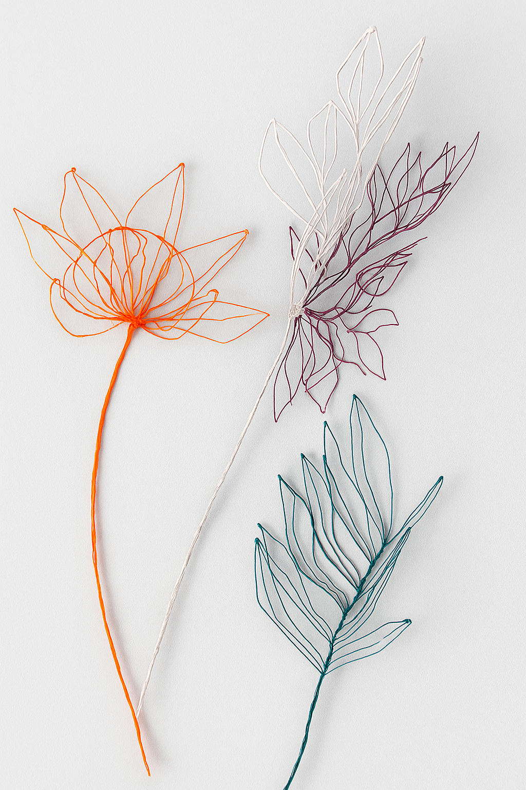 Orange flower + light pink/brown flower + green leaves